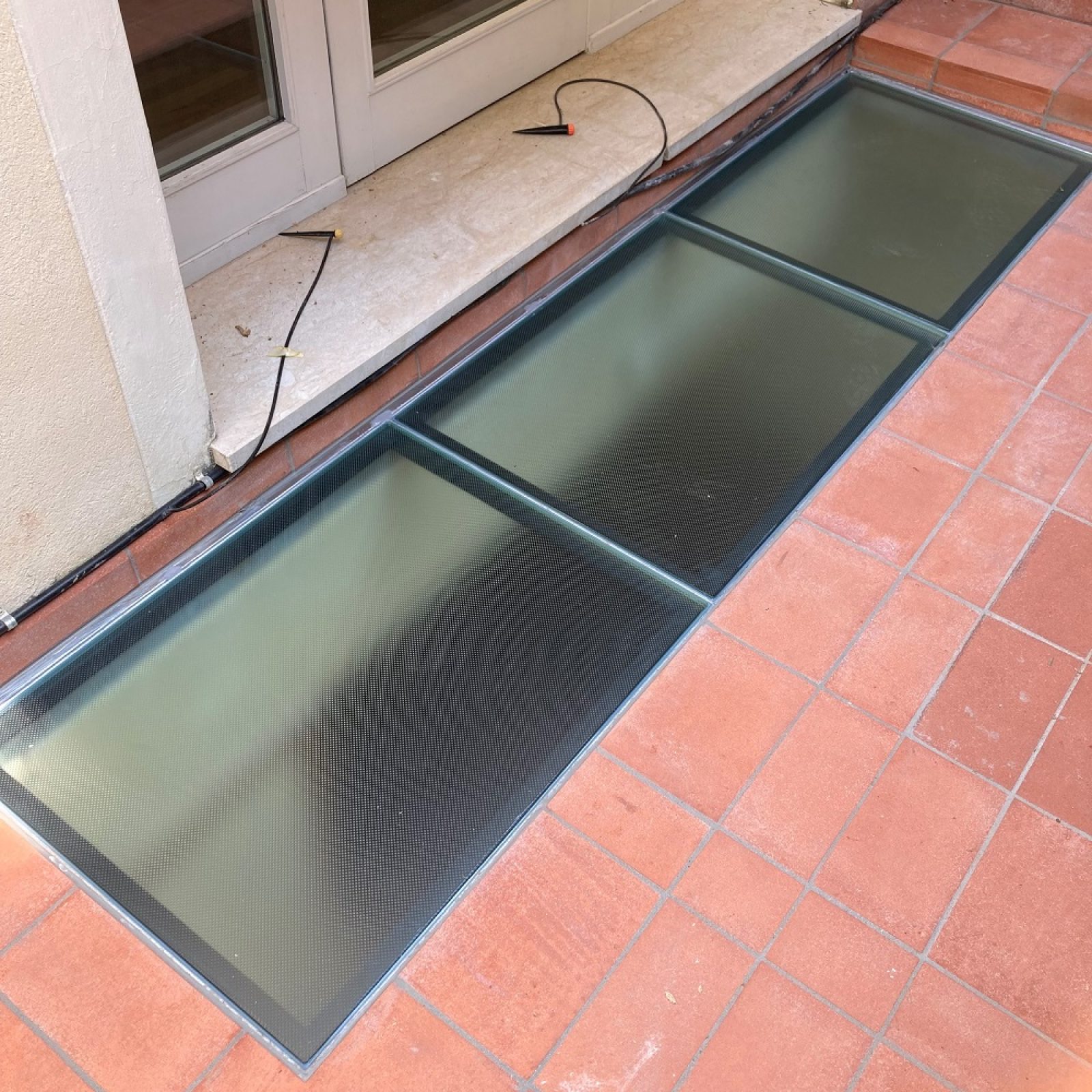 Pavimentazione di vetro per esterno su condominio