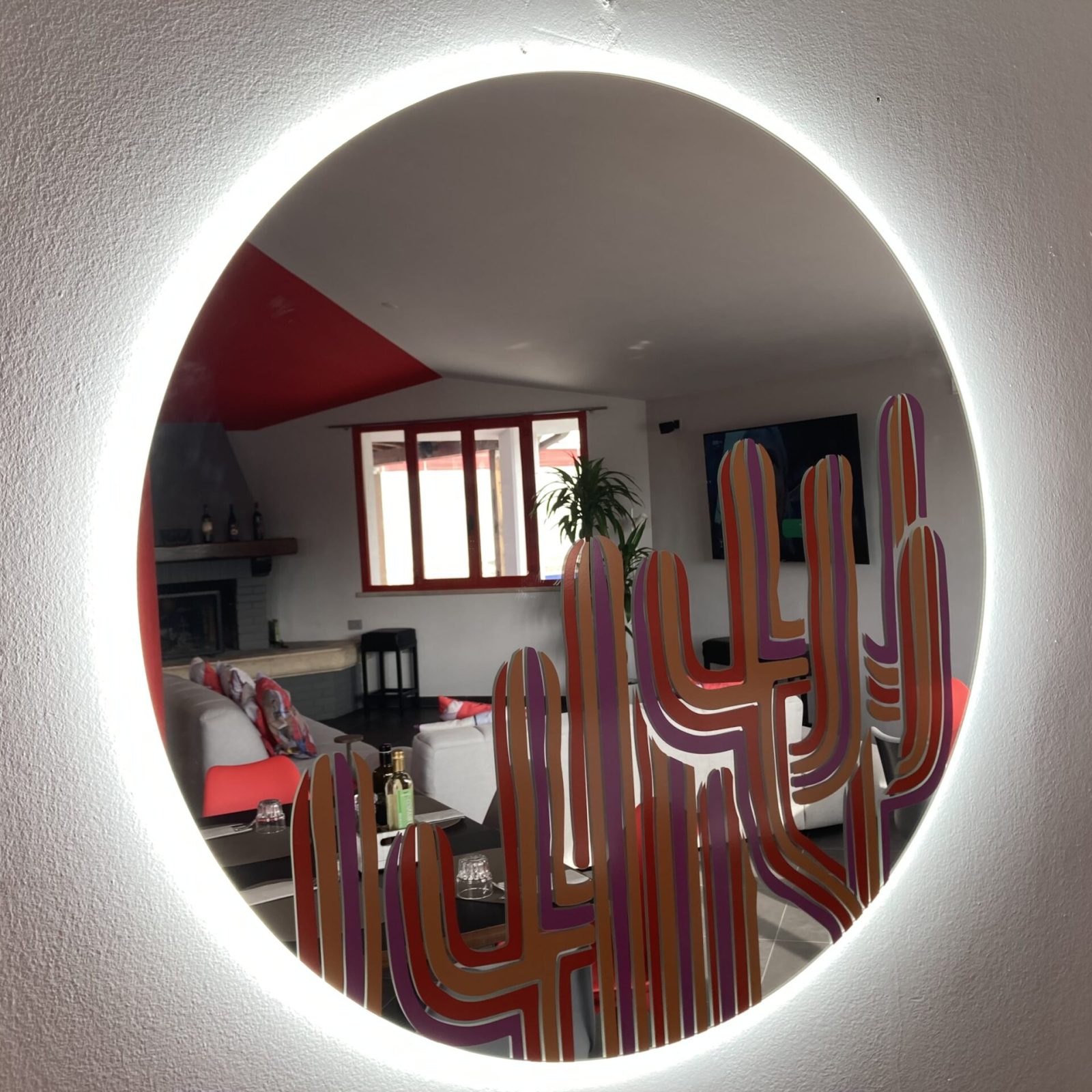 Specchio con led circolare e decorato con grafica
